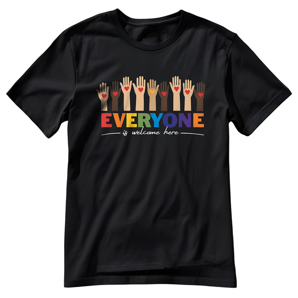 A black t-shirt with a colorful "Everyone is welcome here" design. Above the phrase, multicultural hands are shown with hearts on them.