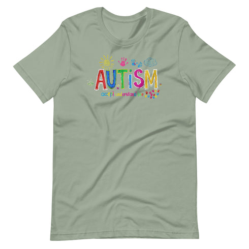 A green t-shirt with a colorful autism awareness design. "Autism" is surrounded by colorful, childlike drawings with "accept understand love" underneath.